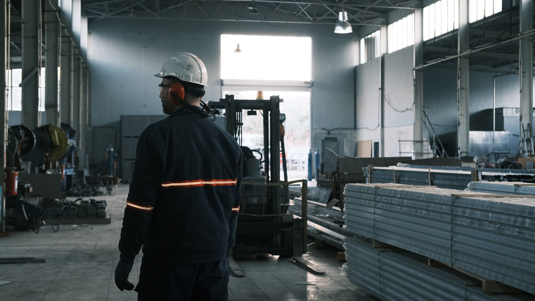 Factory operator reviewing a production workshop before equipment planning
