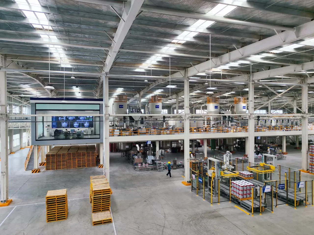 Panoramic view of an automated coatings factory production line